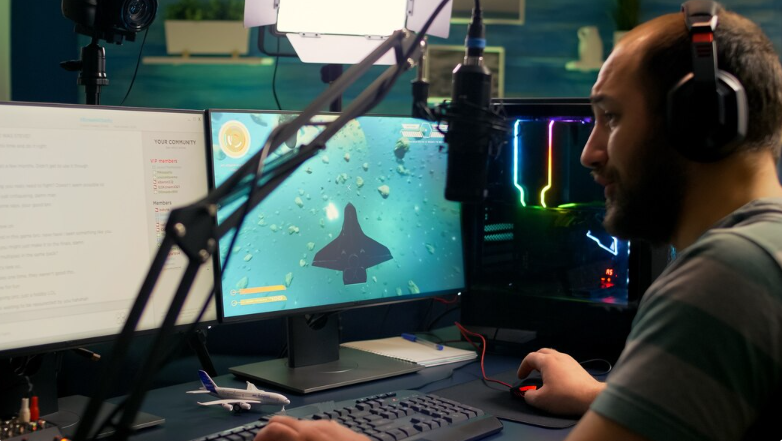 Pro streamer man playing space shooter video games during online competition