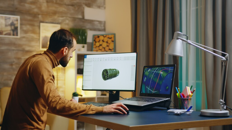 Young engineer in his home office working on developing a new turbine