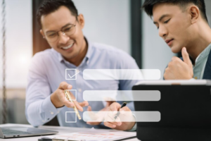 Checklist concept businessman using tablet and laptop