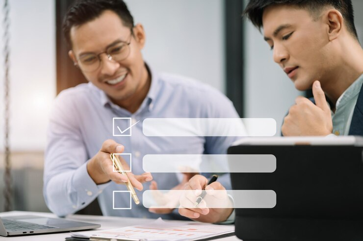 Checklist concept businessman using tablet and laptop